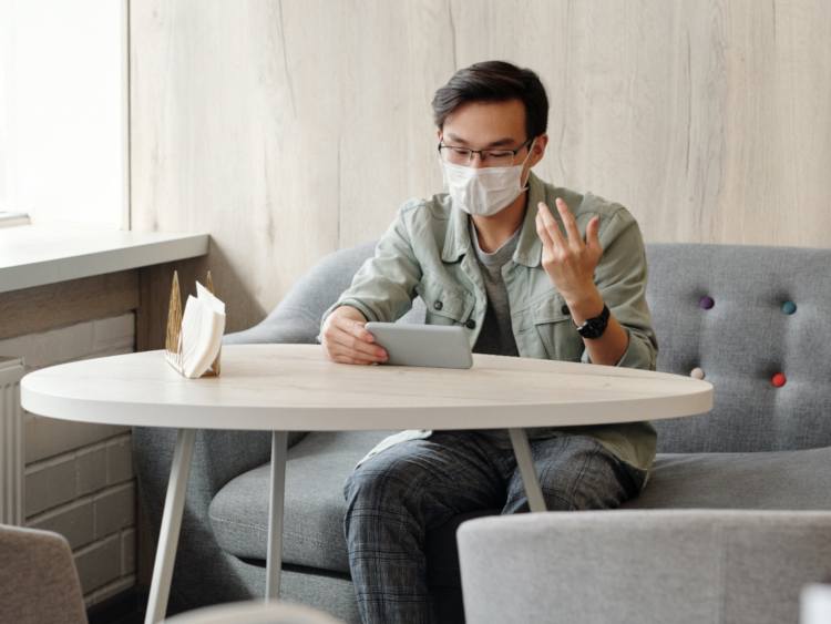 a man with smartphone having videochat